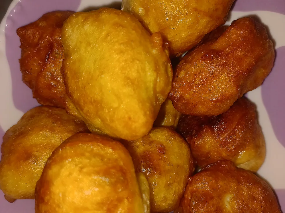 A plate of golden brown puff puff